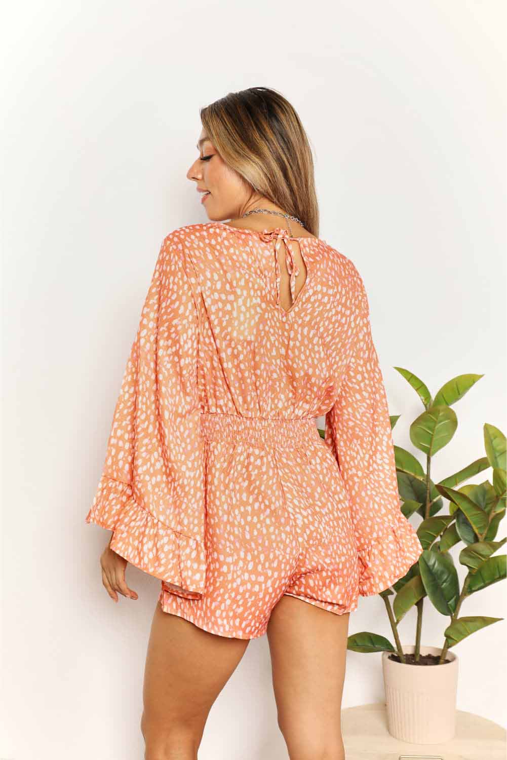 Double Take Printed Flare Sleeve Surplice Romper by Trendsi