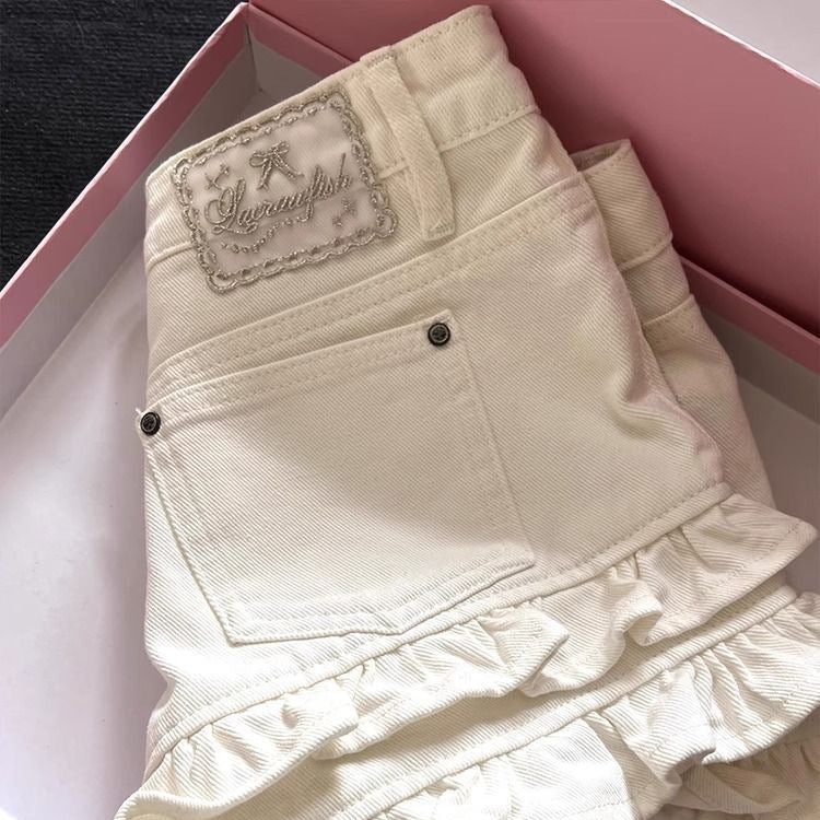 White Ruffled Panel Denim Shorts by Royal Closet