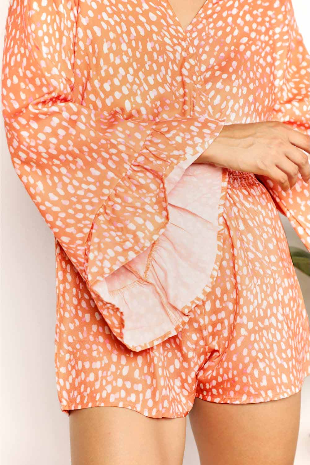 Double Take Printed Flare Sleeve Surplice Romper by Trendsi